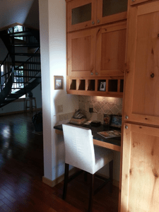  Work area attached to kitchen with custom cabinets 