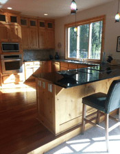 Kitchen area with breakfast bar and custom cabinets 