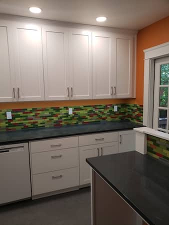  Large kitchen with unique tile design and custom countertop 