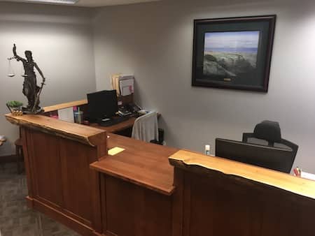  Handcrafted redwood desk in law office 