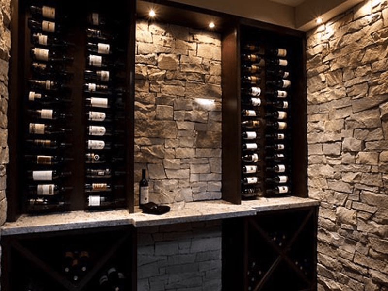  Wine room custom racks and stone wall 